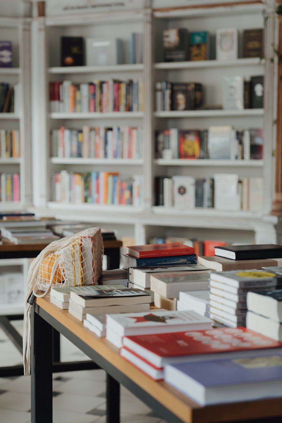 A sunlit room lined with bookshelves